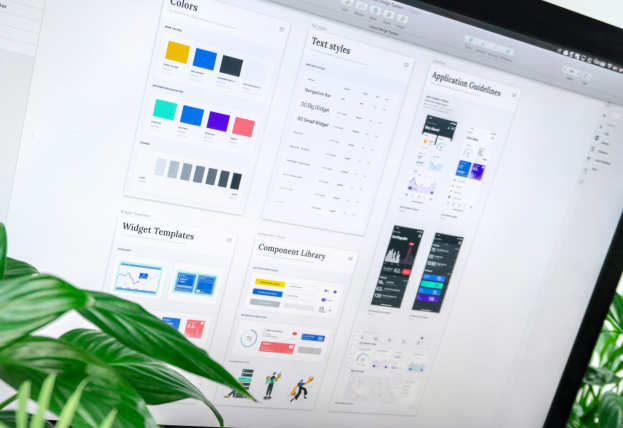 Image Description: A hand-drawn website wireframe sketch with watercolor highlights in blue, purple, and green.